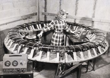 (Original Caption) 9/28/1948-Ithaca, NY: Mrs. Carol Sienko of the Laboratory of Nuclear Studies at Cornell University examines the "glass donut," heart of the Univeristy's new 85-ton Synchrotron. Energy in tube will reach 300 million electron volts. Atom-smasher is part of new laboratory which will be dedicated on October 7.