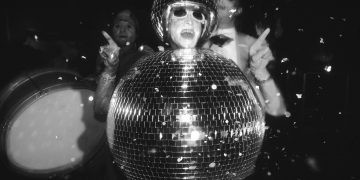 Wow! its a man dressed as a glitterball..UK, 1990s. (Photo by: PYMCA/Universal Images Group via Getty Images)